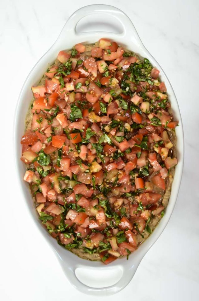 The fourth layer of Italian 5-Layer Dip is tomato bruschetta.