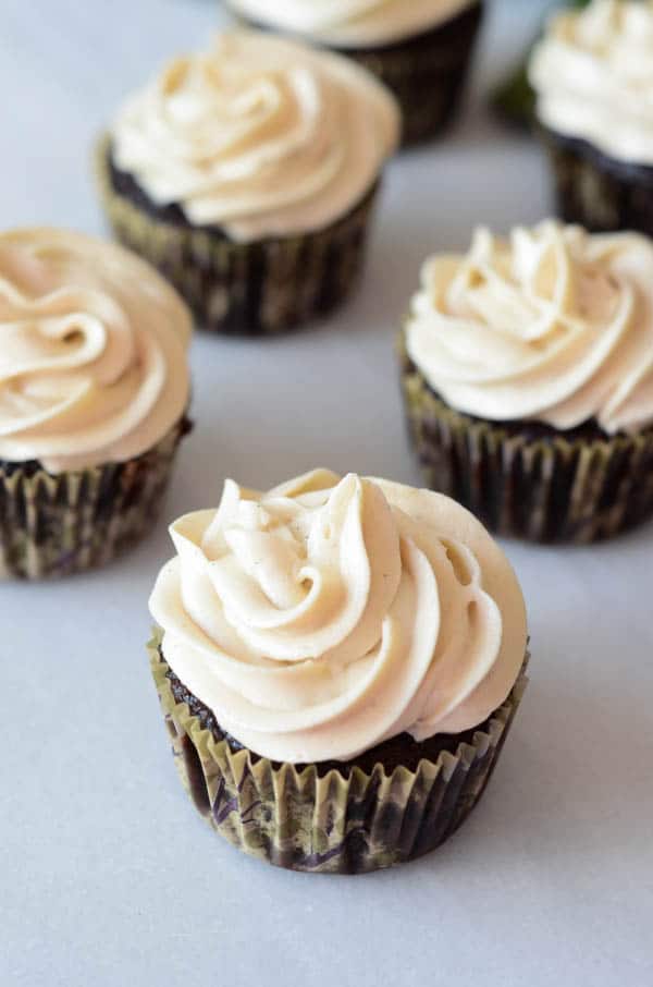 A close-up of frosted chocolate stout cupcakes.
