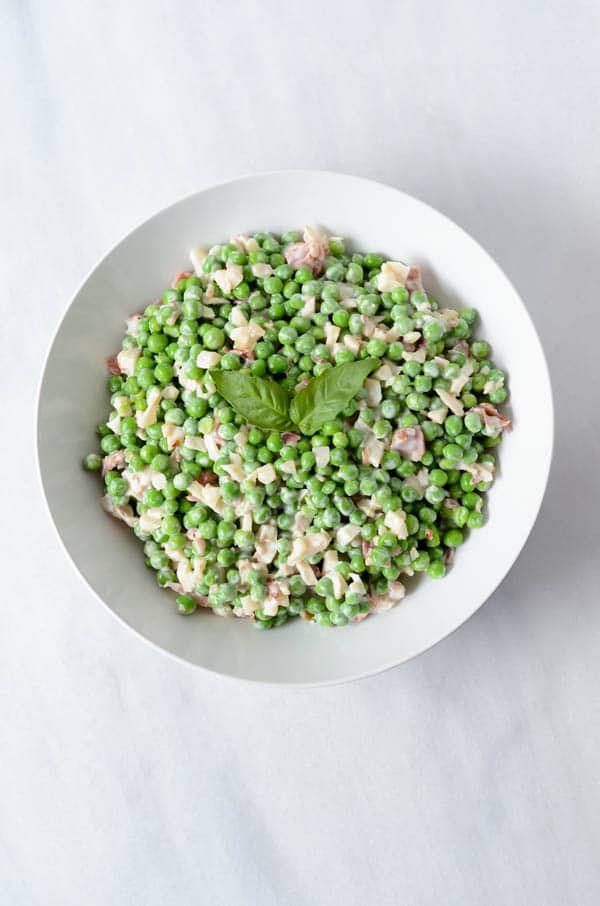 An overhead shot of a bowl of crunchy pea salad.