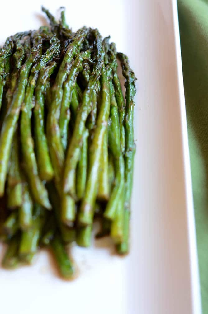 Close-up of a platter of roasted asparagus.