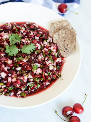 A bowl of delicious Cherry Salsa just waiting to be eaten with your favorite tortilla chips!