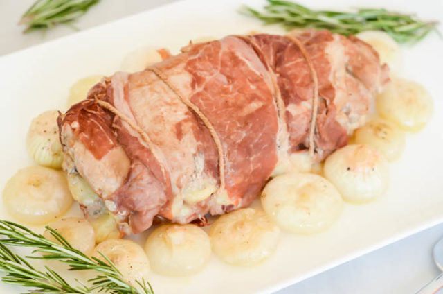 Pear and Gruyere Stuffed Pork Tenderloin with Roasted Cippolini Onions is the perfect main event for any family dinner.