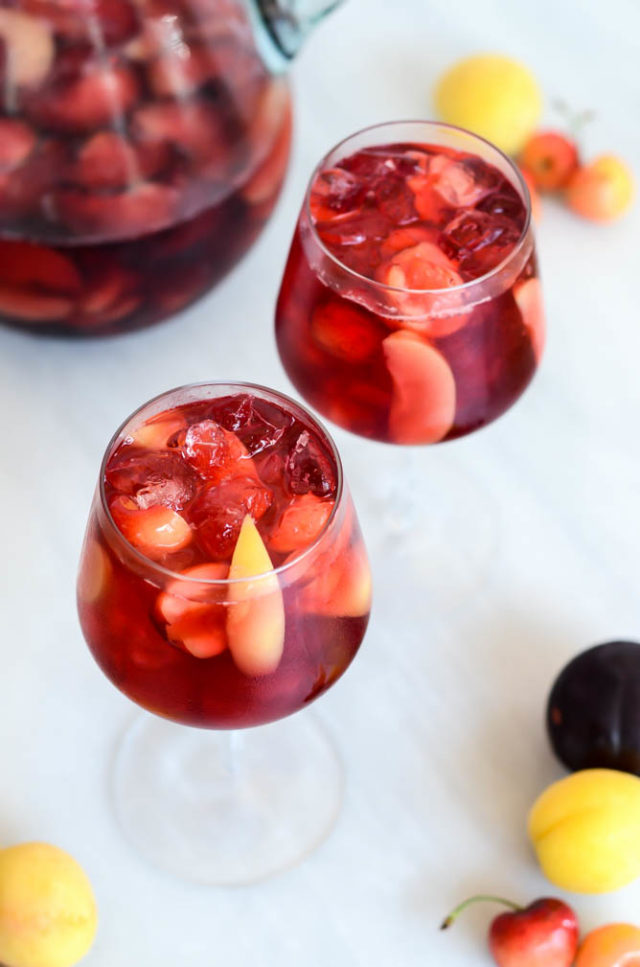 An overhead shot of two glasses of refreshing Virgin Stone Fruit Sangria, perfect for summer entertaining!