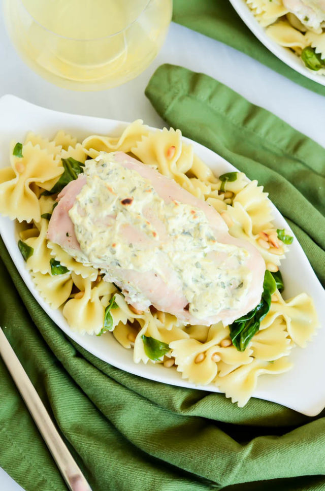 Spinach Artichoke Dip Chicken served over a simple bowtie pasta for the perfect kid-friendly weeknight dinner.