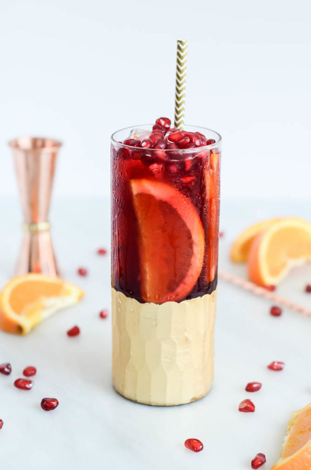 A glass of Citrus, Pomegranate and Cherry Kombucha Punch is the perfect way to kick off the first weekend of fall.