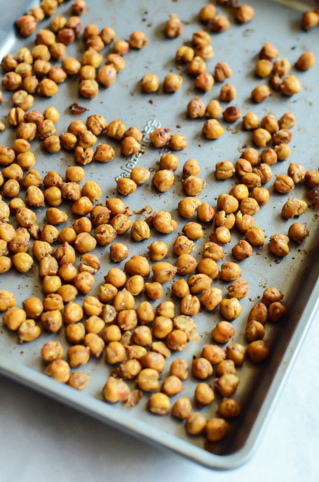 Savory pumpkin spice roasted chickpeas are the perfect addition to a Fall Harvest Chopped Salad.