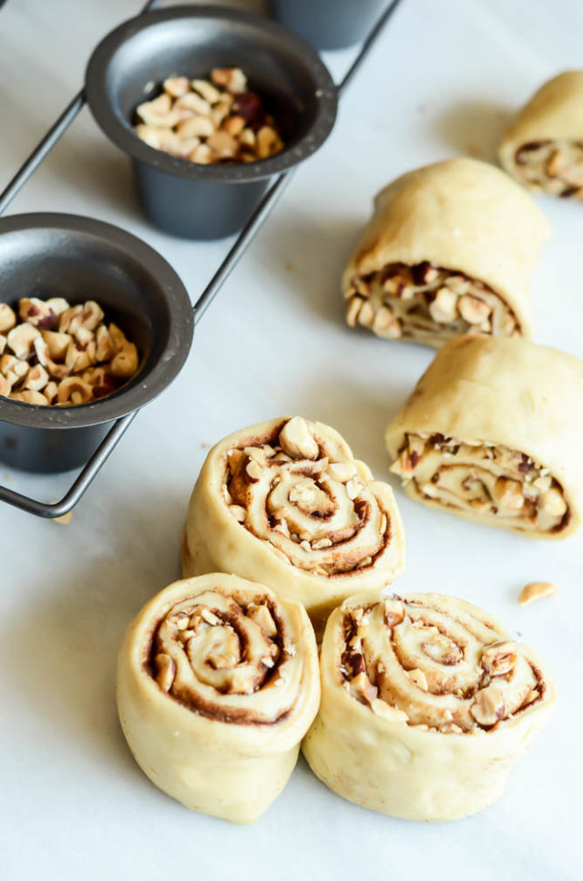 The dough for Weekend Hazelnut Sticky Buns with Date Caramel is studded with so many delicious ingredients.