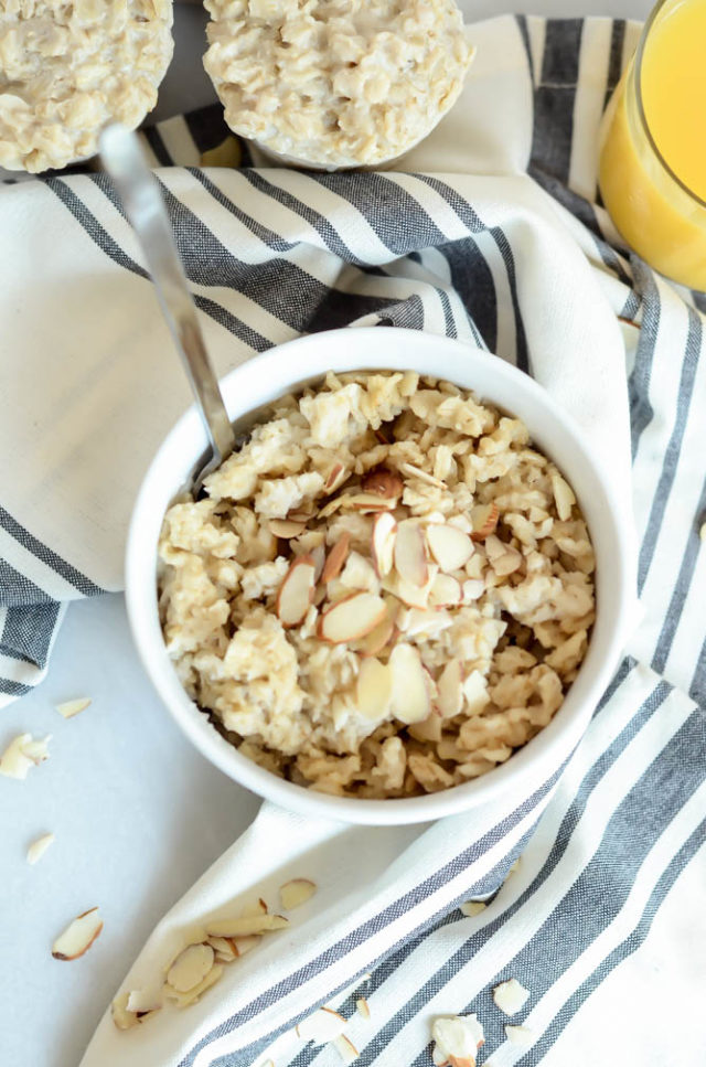 An overhead shot of a bowl of make-ahead oatmeal topped with sliced almonds.