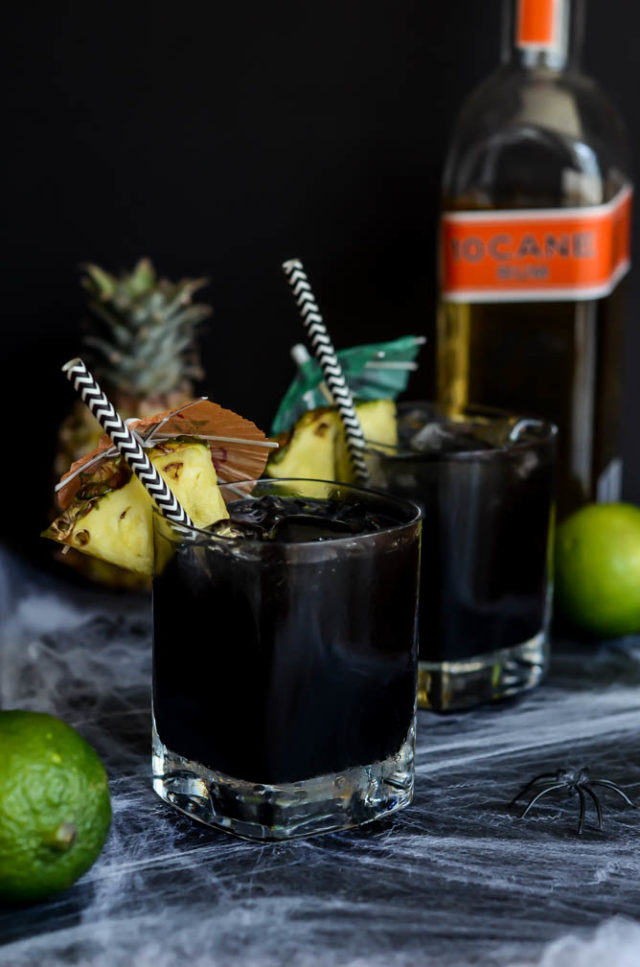 This Midnight Mai Tai features a spooky twist on the classic tiki drink with the addition of activated charcoal.