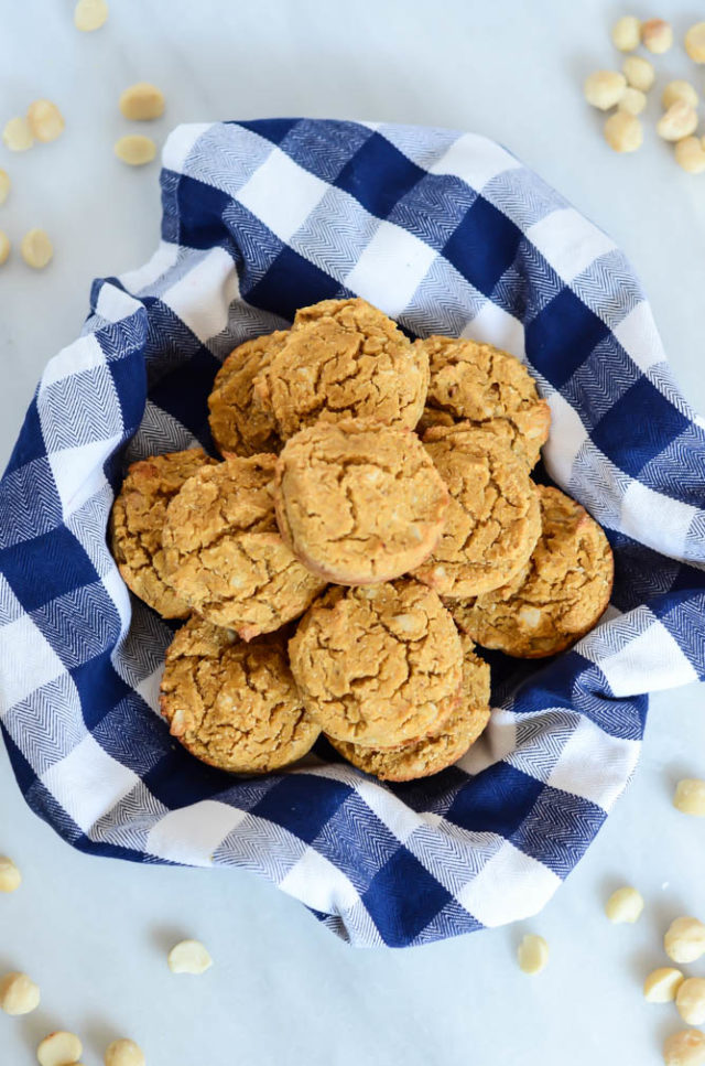 A basket of Easy Pumpkin Macadamia Nut Muffins is the perfect breakfast for a busy fall morning.