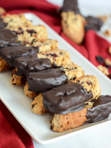 These Chocolate Dipped Cranberry Walnut Biscotti are fantastic dipped in coffee or a hot toddy!