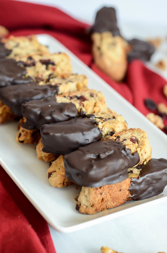 These Chocolate Dipped Cranberry Walnut Biscotti are fantastic dipped in coffee or a hot toddy!
