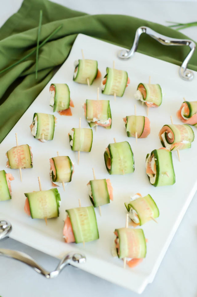 A tray of Five-Ingredient Smoked Salmon and Cucumber Roll-Ups will be a huge hit at your next holiday party!