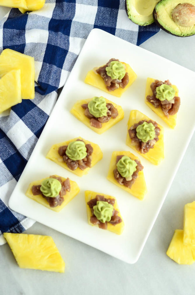 A tray of Ahi Poke Pineapple Bites with Avocado Mousse is sure to be the star hors d'oeuvres at your next party!