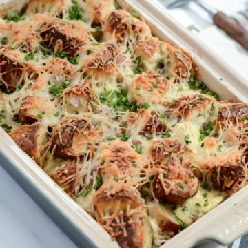 A hearty dish of Indulgent Smoked Salmon and Bagel Breakfast Casserole is delicious, easy to assemble and sure to feed a crowd at brunch!