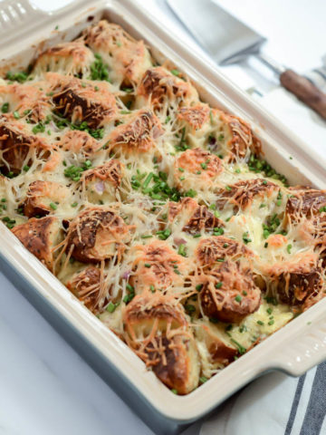 A hearty dish of Indulgent Smoked Salmon and Bagel Breakfast Casserole is delicious, easy to assemble and sure to feed a crowd at brunch!