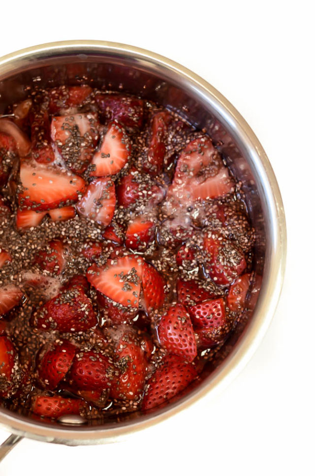 Strawberries simmer over the stove to make a delicious jam for Easy No-Bake Honey Roasted Peanut Butter and Jelly Bars.