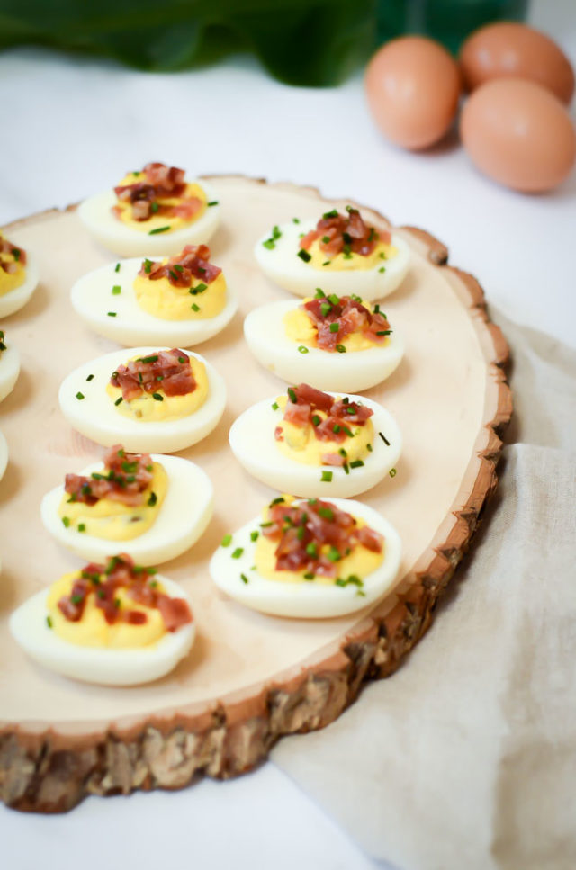 These Candied Bacon Deviled Eggs are the perfect appetizer for your next brunch or Easter get-together. | CaliGirlCooking.com