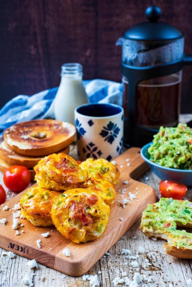 Breakfast Egg Muffins are laid out on a table with a wholesome breakfast spread. 