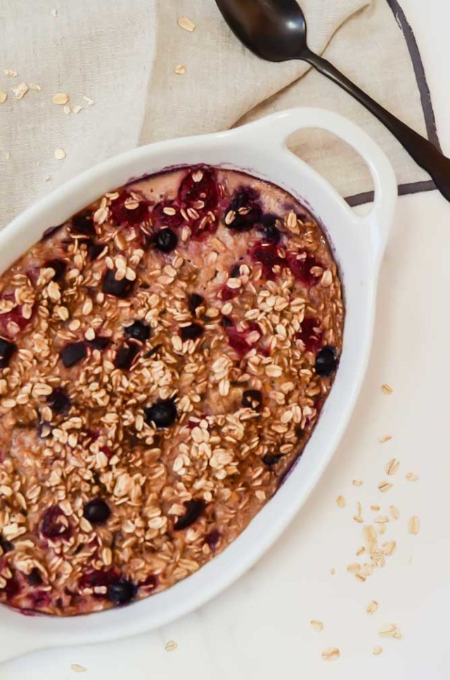An overhead shot of a dish of beet and berry baked oatmeal, one of the best foods for 9-month-olds!