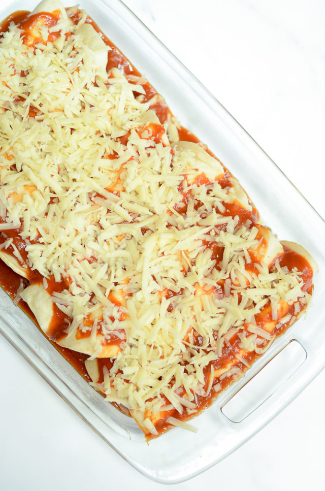 A dish of make-ahead breakfast enchiladas all prepped and ready to be refrigerated or frozen until serving.