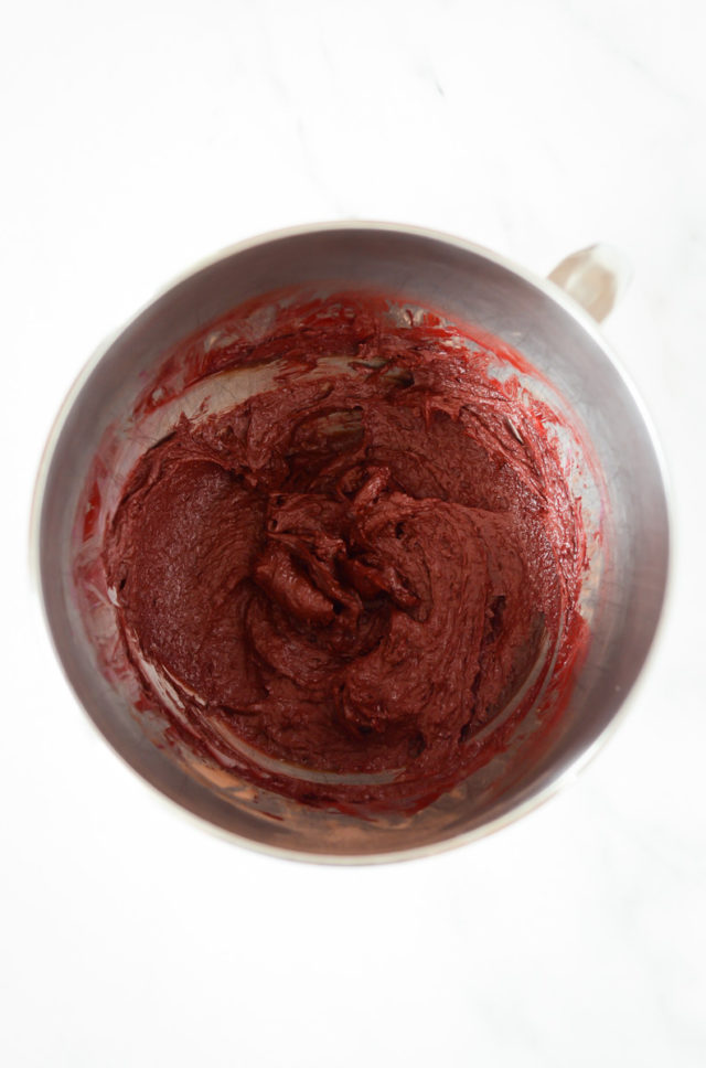 A mixing bowl of red velvet brownie batter.