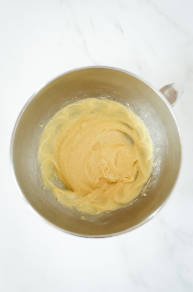 A mixing bowl of creamed butter and sugar.