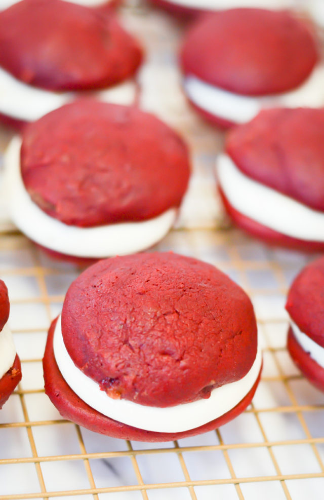 A close-up of red velvet whoopie pies filled with peppermint cream.