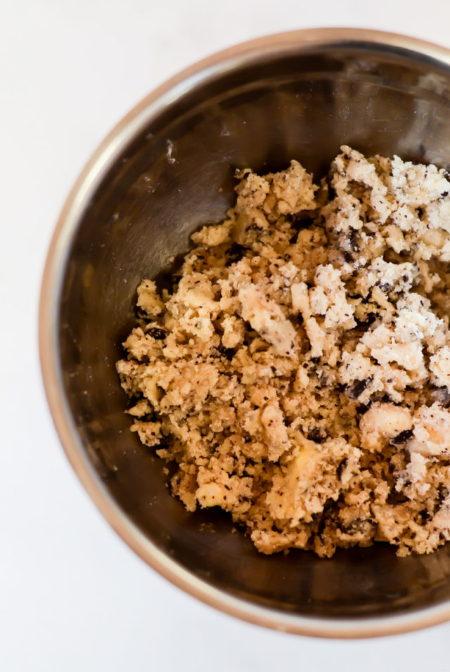 A mixing bowl of crumbly chocolate streusel.