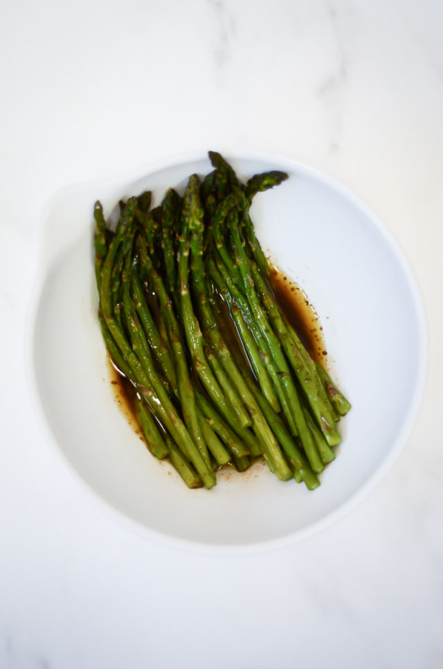 A bowl of brown butter balsamic roasted asparagus.