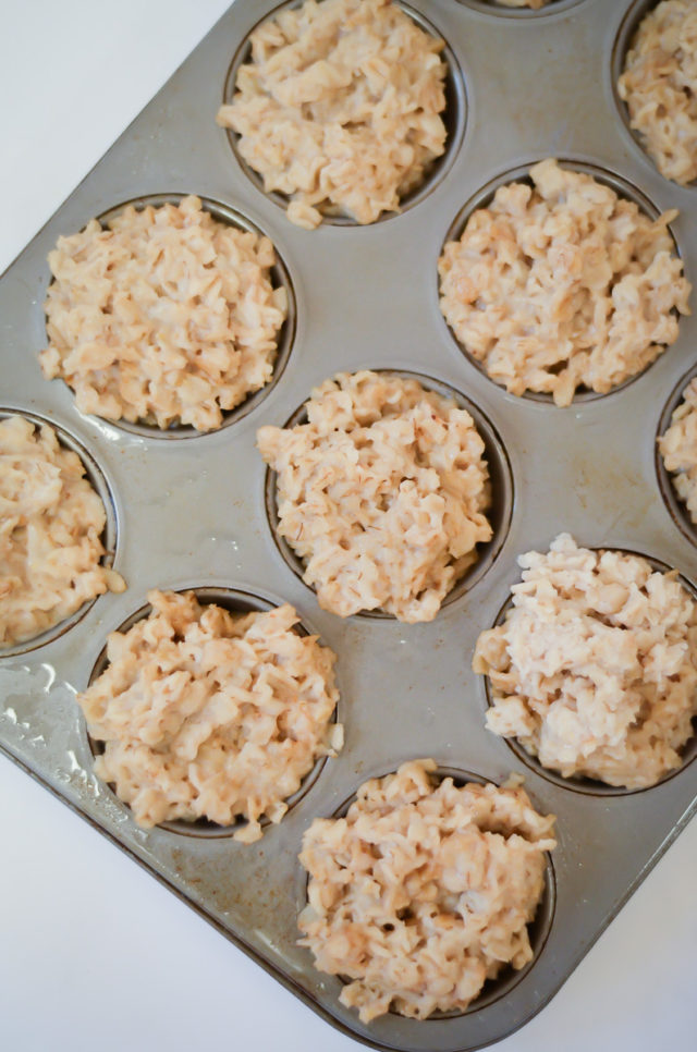 An overhead shot of oatmeal in muffin tins.
