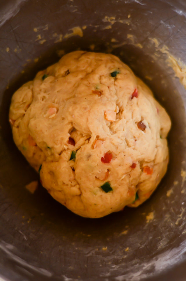 A bowl of hot cross bun dough that has doubled in size.