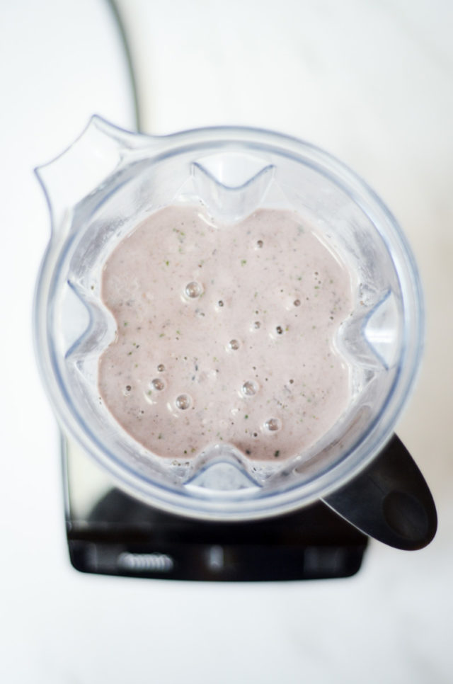 An overhead shot of a smoothie in a blender.